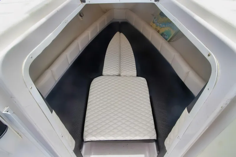 Slide: The Image of 2005 Donzi 35 ZF Cuddy cabin interior with cushioned seating. - 14