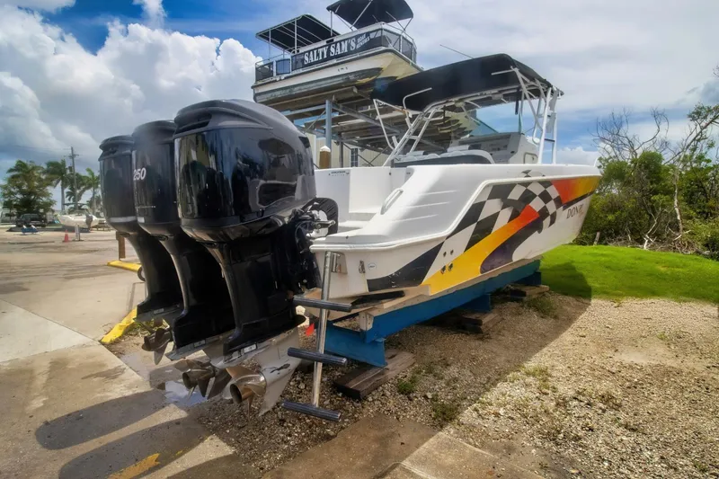 Slide: The Image of 2005 Donzi 35 ZF Cuddy boat with twin engines on a trailer. - 6