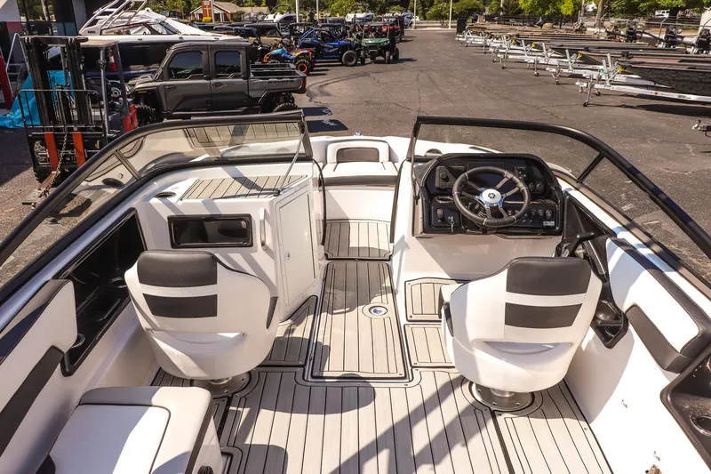 Slide: The Image of 2025 Yamaha Boats 195S interior with sleek design and modern dashboard. - 13