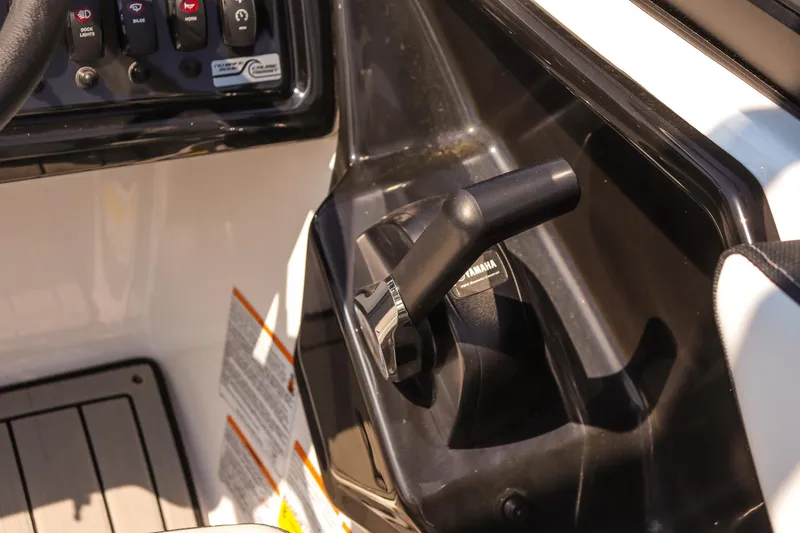 Slide: The Image of 2025 Yamaha Boats 195S throttle control in cockpit, showcasing sleek design and functionality. - 15