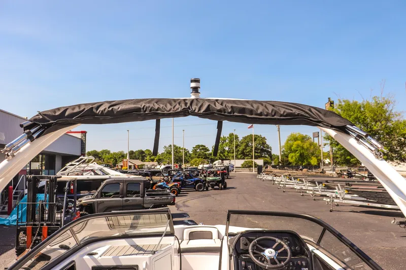 Slide: The Image of 2025 Yamaha Boats 195S interior view with steering wheel and outdoor setting. - 22