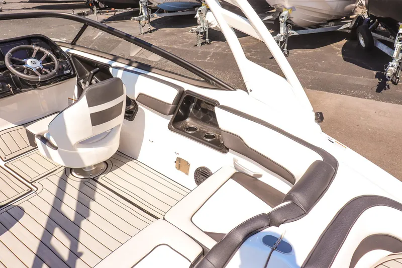 Slide: The Image of 2025 Yamaha Boats 195S interior with sleek seating and modern dashboard design. - 24
