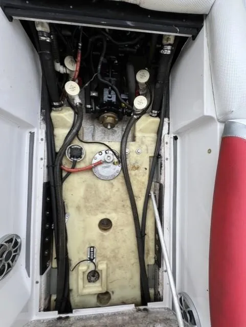 Slide: The Image of Engine compartment of a 2015 Tigé RZR boat, showing wiring and components. - 14