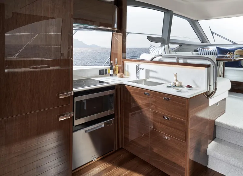 Slide: The Image of Luxurious 2025 Princess F50 yacht kitchen with modern appliances and ocean view. - 14