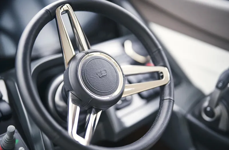 Slide: The Image of Steering wheel of 2025 Princess F50 yacht, showcasing modern design and luxury craftsmanship. - 26