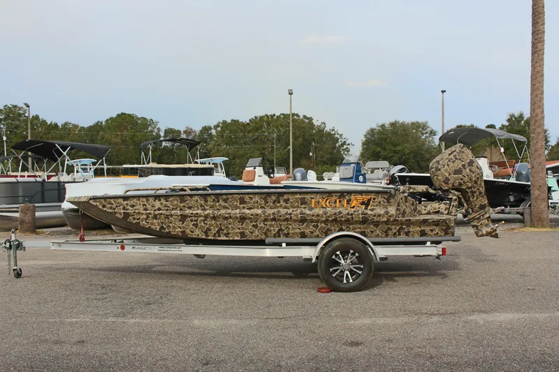 The Image of 2025 Excel 1860 Viper F4 CC boat with camouflage design on a trailer. - 1