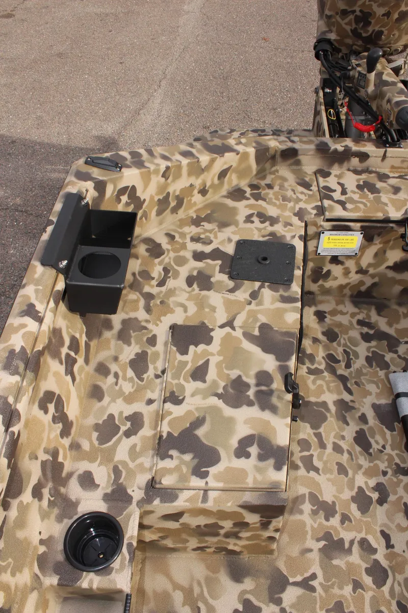 Slide: The Image of 2025 Excel 1860 Viper F4 CC boat interior with camouflage design and cup holders. - 18