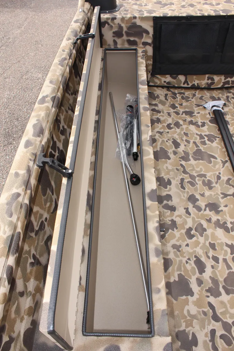 Slide: The Image of 2025 Excel 1860 Viper F4 CC boat interior with camouflage design and storage compartment. - 23