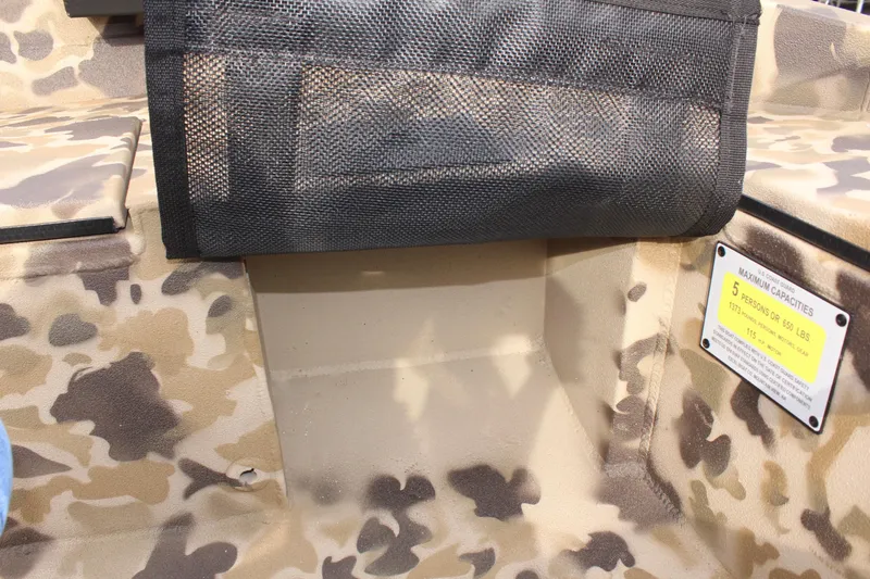 Slide: The Image of Camouflage interior of 2025 Excel 1860 Viper F4 CC boat with safety warning label. - 26