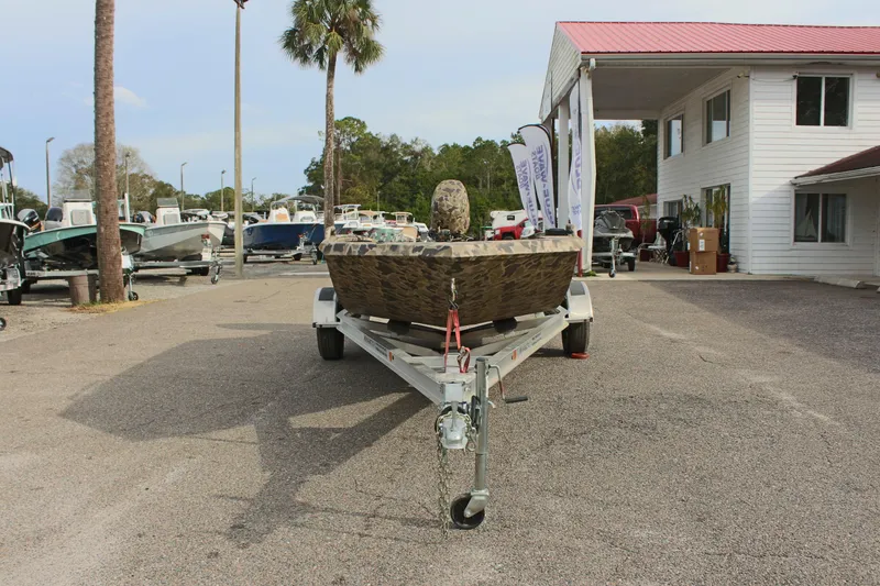 Slide: The Image of 2025 Excel 1860 Viper F4 CC boat on trailer in marina parking lot. - 4