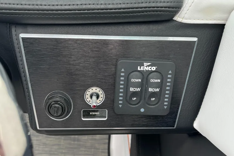 Slide: The Image of 2022 Four Winns H4 OB boat control panel with Lenco trim tab switches. - 12