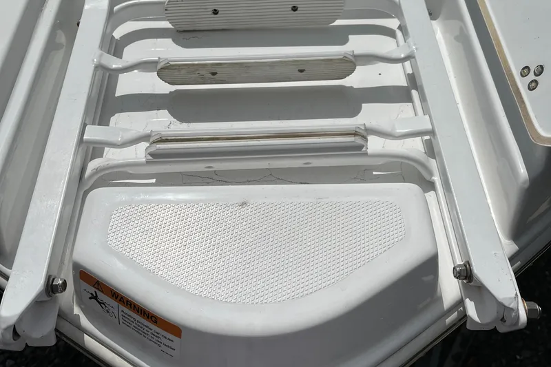 Slide: The Image of 2022 Four Winns H4 OB boat swim platform with ladder. - 5