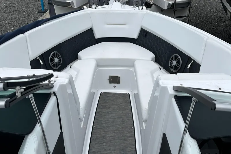 Slide: The Image of 2022 Four Winns H4 OB boat interior with white seating and speakers. - 7