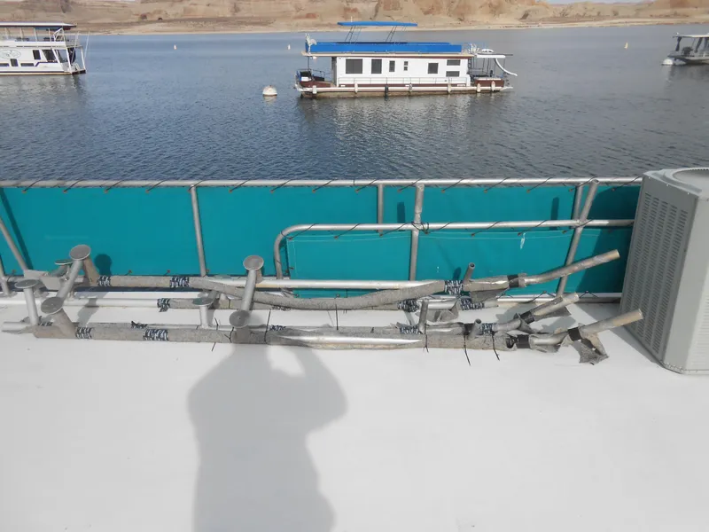 Slide: The Image of Houseboats on a lake, Horizon model, 1999, with blue accents and railing. - 28