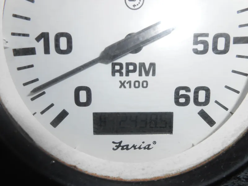 Slide: The Image of Close-up of Faria RPM gauge on 1999 Horizon houseboat. - 36