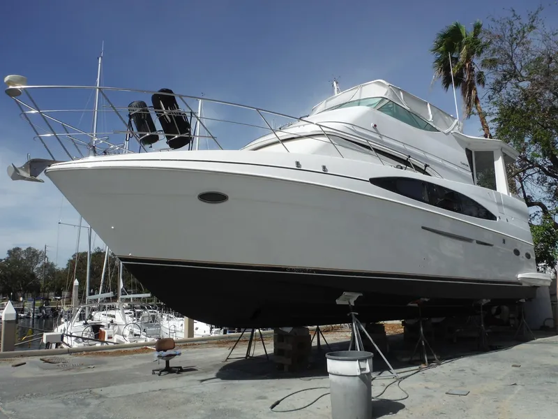 Slide: The Image of 2001 Carver 466 Motor Yacht on dry dock, ready for maintenance. - 1