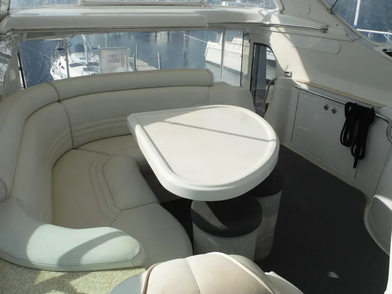 Slide: The Image of Luxurious interior of 2001 Carver 466 Motor Yacht with plush seating and table. - 11