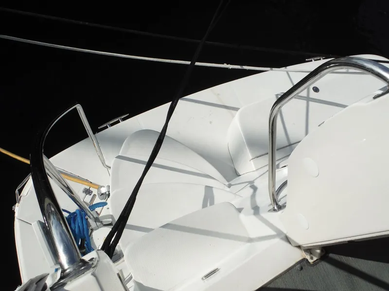 Slide: The Image of 2001 Carver 466 Motor Yacht deck with seating and railing. - 13