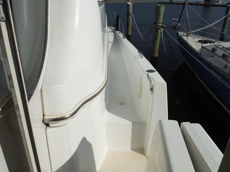 Slide: The Image of Carver 466 Motor Yacht 2001, side deck view, docked at marina. - 14