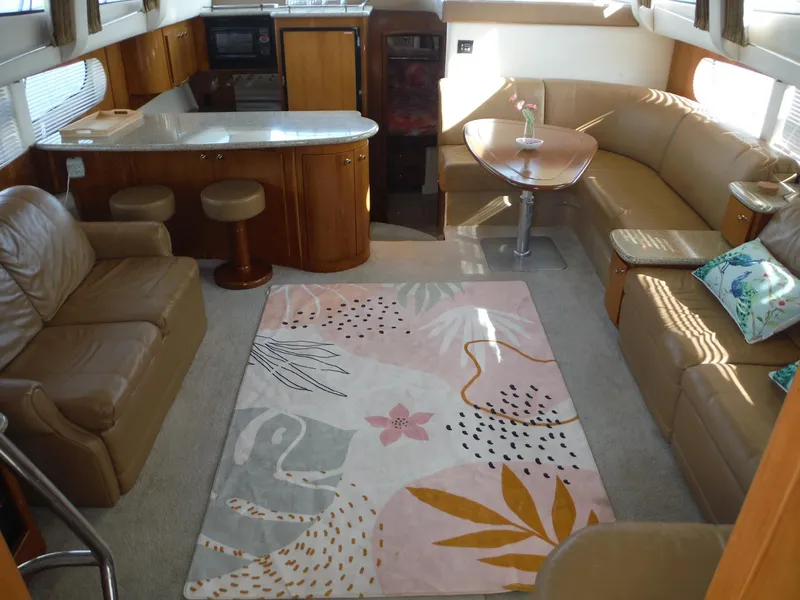 Slide: The Image of Luxurious interior of 2001 Carver 466 Motor Yacht with modern furnishings and stylish decor. - 16