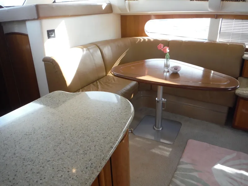 Slide: The Image of Interior of 2001 Carver 466 Motor Yacht with leather seating and dining table. - 18