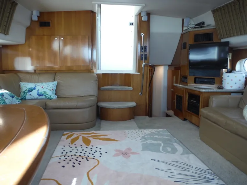 Slide: The Image of Interior of 2001 Carver 466 Motor Yacht with cozy seating and modern amenities. - 19
