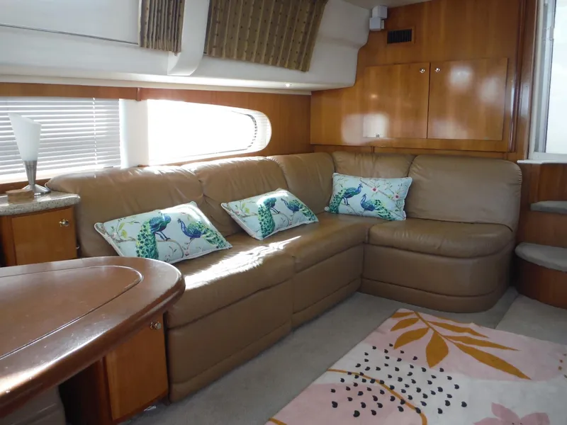 Slide: The Image of Luxurious interior of 2001 Carver 466 Motor Yacht with leather seating and decorative pillows. - 20