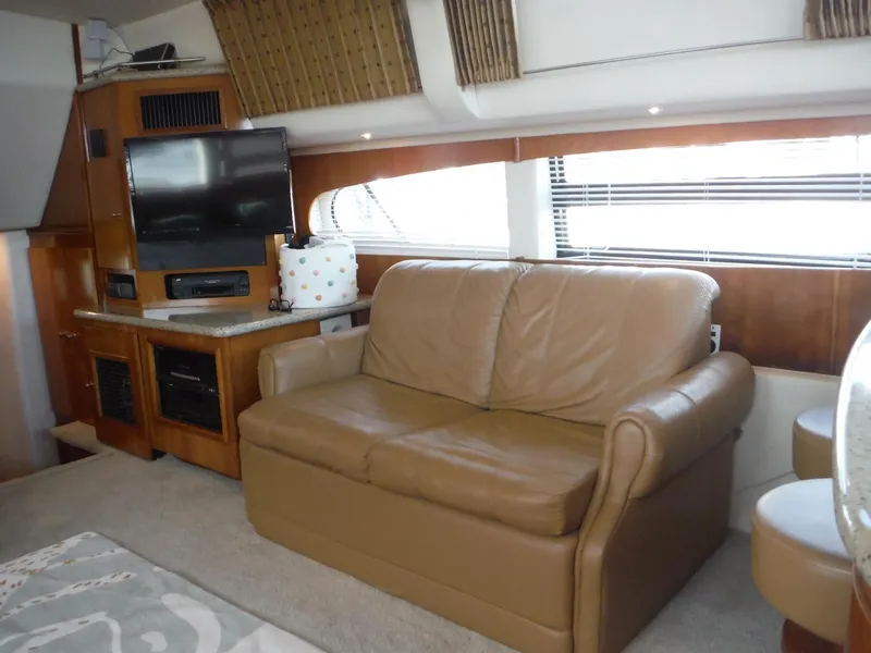 Slide: The Image of Interior of 2001 Carver 466 Motor Yacht with leather sofa and entertainment center. - 21