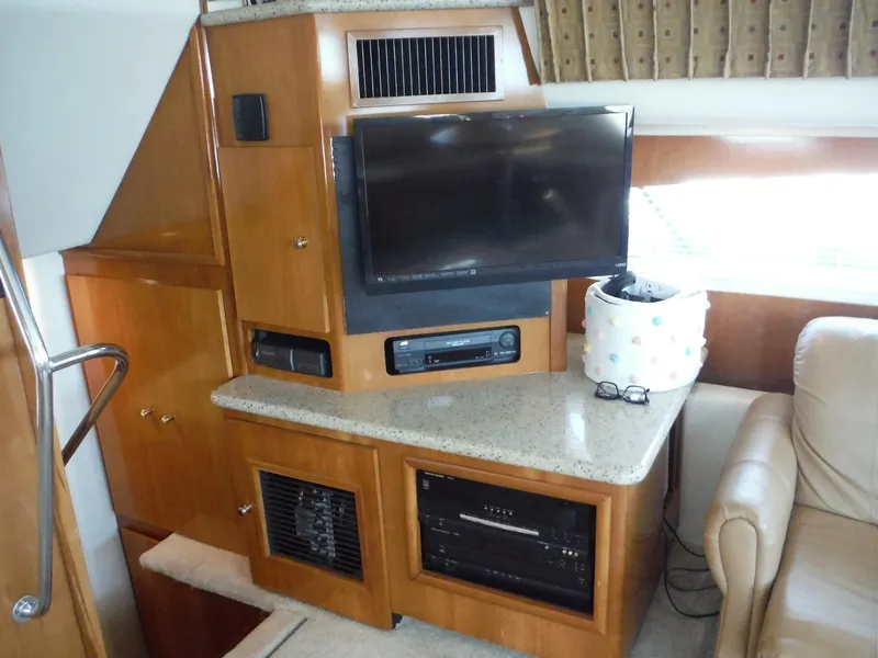 Slide: The Image of Interior of 2001 Carver 466 Motor Yacht with TV and entertainment center. - 23
