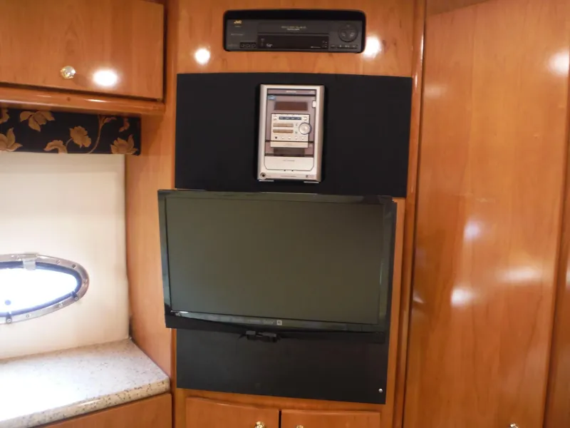 Slide: The Image of Entertainment system in 2001 Carver 466 Motor Yacht interior with TV and stereo. - 26