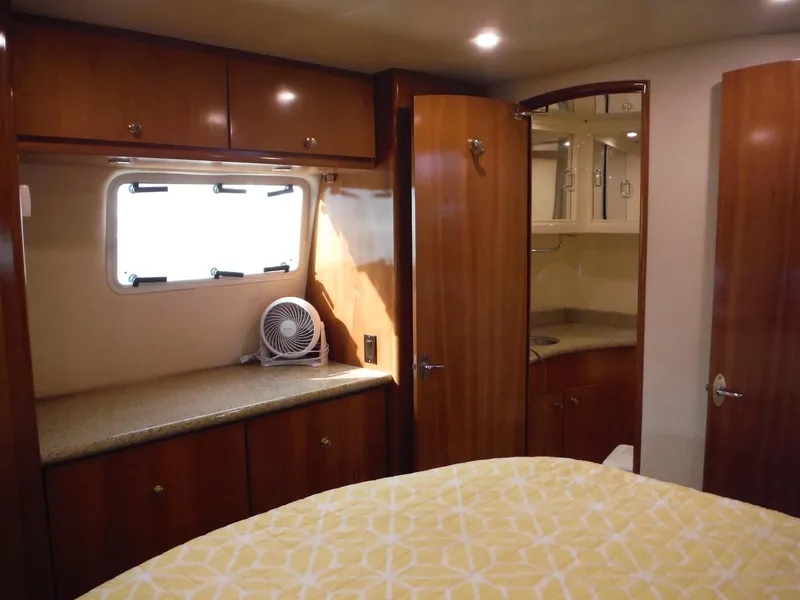 Slide: The Image of Interior of 2001 Carver 466 Motor Yacht with wood cabinetry and cozy bedroom. - 27