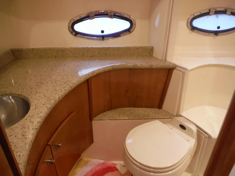 Slide: The Image of Luxurious bathroom in 2001 Carver 466 Motor Yacht with granite countertop and oval window. - 28
