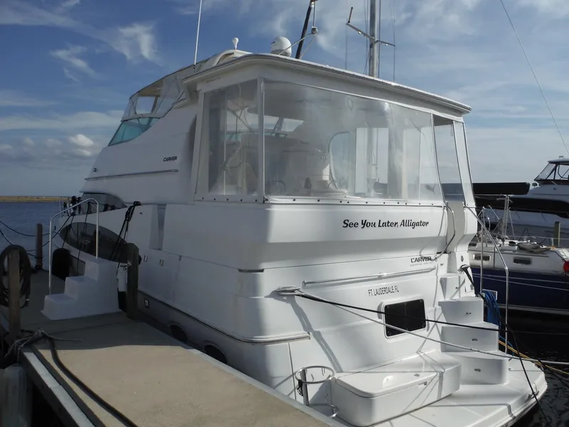 Slide: The Image of 2001 Carver 466 Motor Yacht docked at marina, rear view. - 3