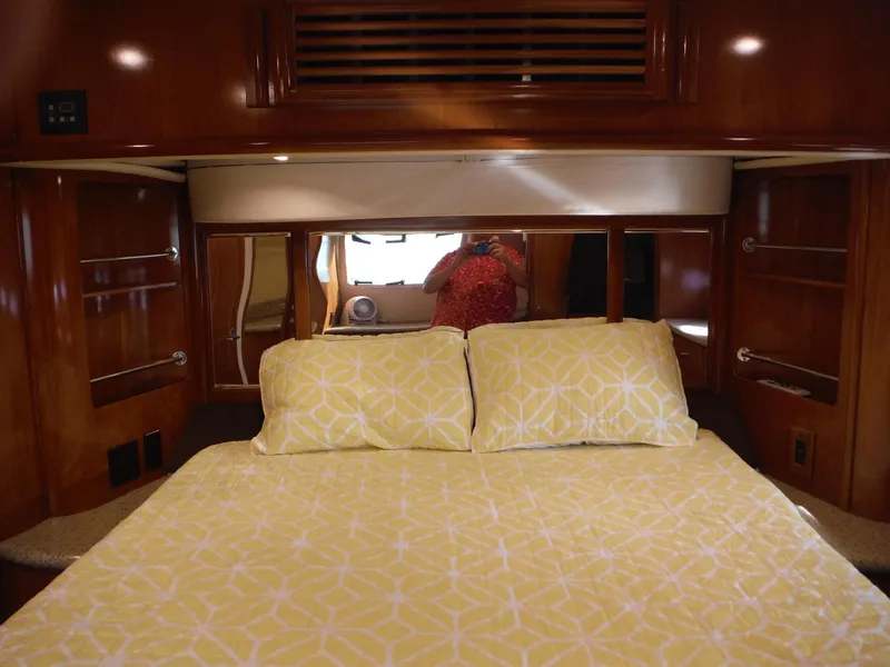 Slide: The Image of Luxurious bedroom interior of 2001 Carver 466 Motor Yacht with yellow bedding. - 30