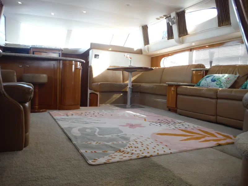 Slide: The Image of Luxurious interior of 2001 Carver 466 Motor Yacht with plush seating and elegant decor. - 31