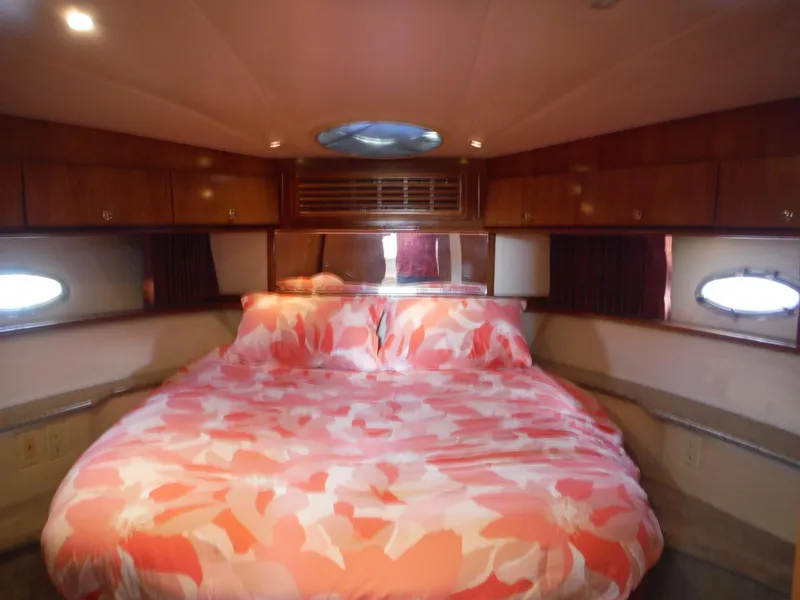 Slide: The Image of Luxurious bedroom interior of 2001 Carver 466 Motor Yacht with floral bedding. - 33