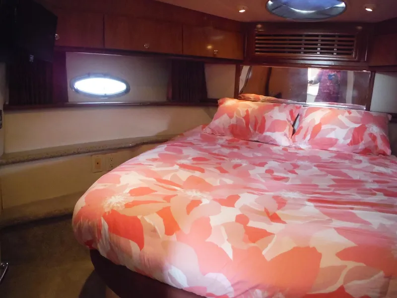 Slide: The Image of Luxurious bedroom interior of 2001 Carver 466 Motor Yacht with floral bedding. - 35
