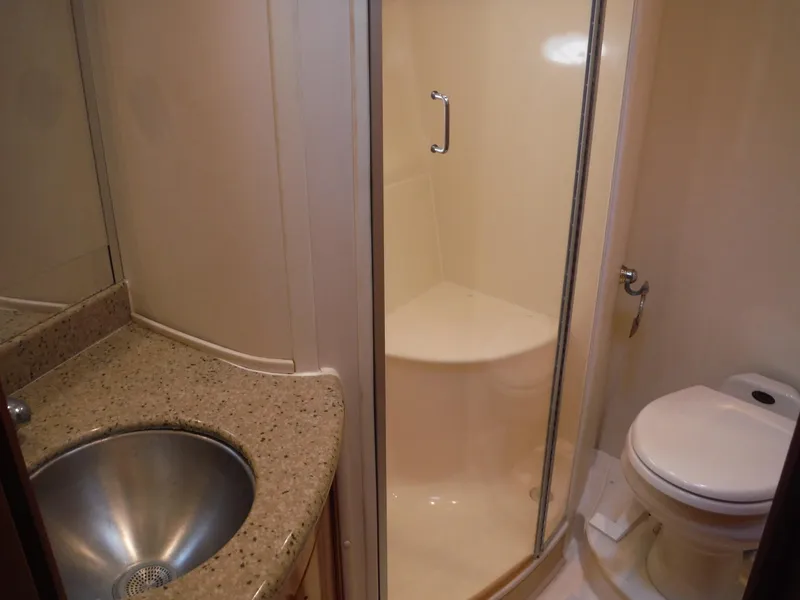 Slide: The Image of Bathroom interior of 2001 Carver 466 Motor Yacht with shower, sink, and toilet. - 37