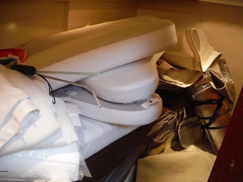 Slide: The Image of Interior storage area of 2001 Carver 466 Motor Yacht with cushions and covers. - 38