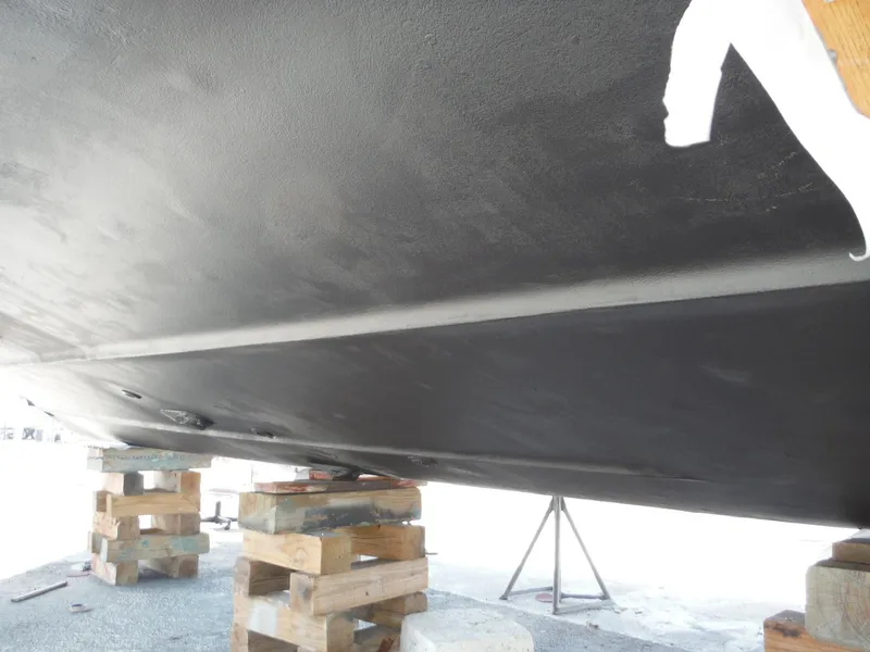 Slide: The Image of Bottom view of 2001 Carver 466 Motor Yacht on wooden blocks. - 46