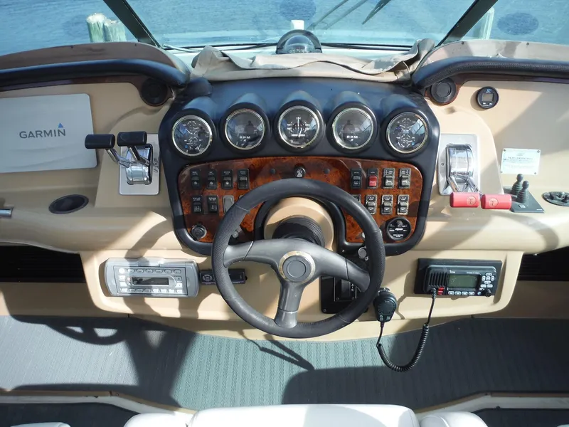 Slide: The Image of Dashboard of 2001 Carver 466 Motor Yacht with steering wheel and navigation instruments. - 7