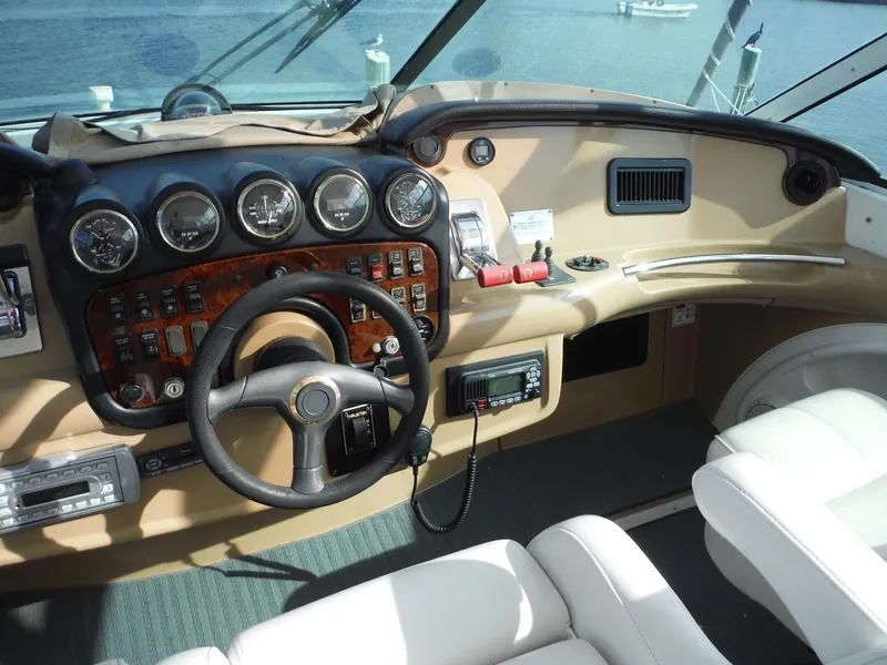 Slide: The Image of 2001 Carver 466 Motor Yacht helm with gauges and steering wheel. - 9
