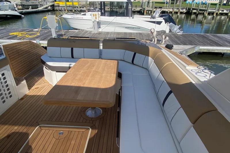 Slide: The Image of 2019 Sea Ray SLX 400 yacht docked at marina under clear blue sky. - 30