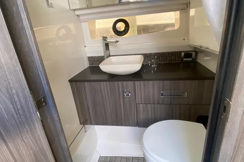 Slide: The Image of Luxurious interior of 2019 Sea Ray SLX 400 yacht with plush seating and modern design. - 34