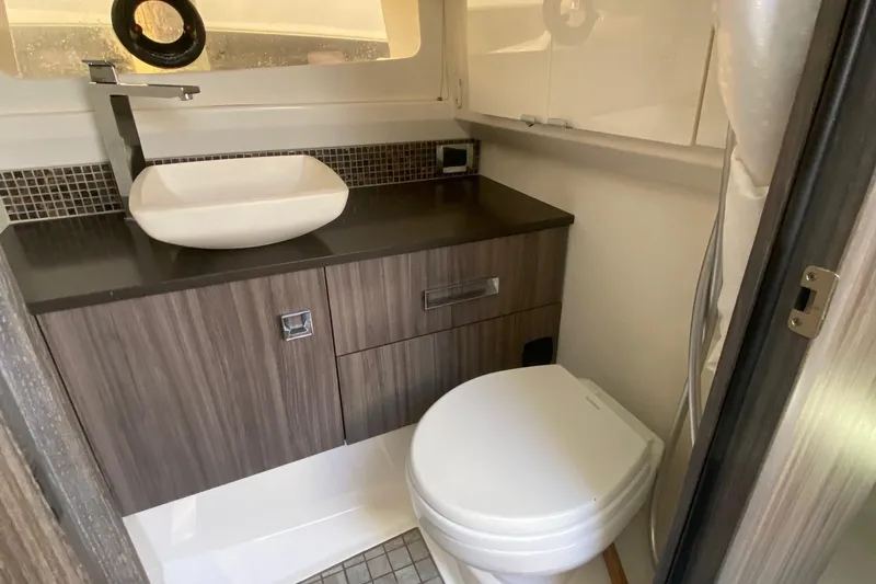 Slide: The Image of Luxurious bathroom in 2019 Sea Ray SLX 400 yacht with modern fixtures and sleek design. - 35