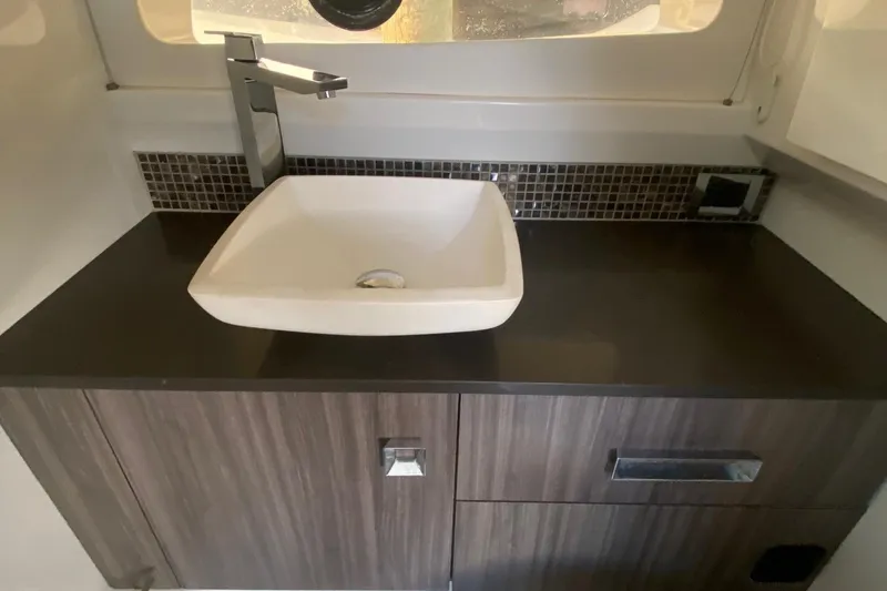 Slide: The Image of Luxurious bathroom interior of 2019 Sea Ray SLX 400 yacht with modern fixtures. - 36