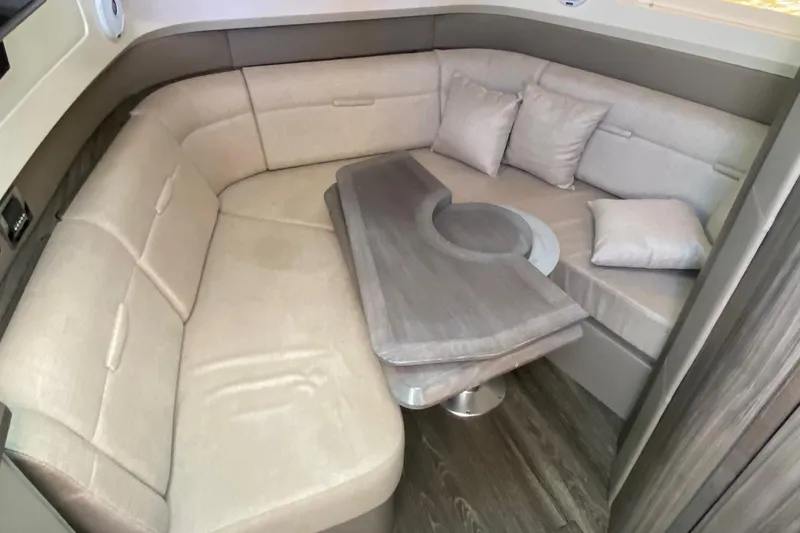 Slide: The Image of Luxurious interior of 2019 Sea Ray SLX 400 yacht with plush seating and table. - 38