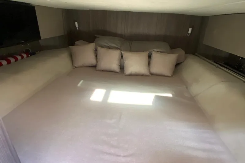 Slide: The Image of Interior cabin of 2019 Sea Ray SLX 400 with cozy bedding and pillows. - 42
