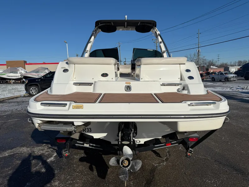 Slide: The Image of 2005 Sea Ray 270 SLX boat, rear view, on a trailer in a parking lot. - 13