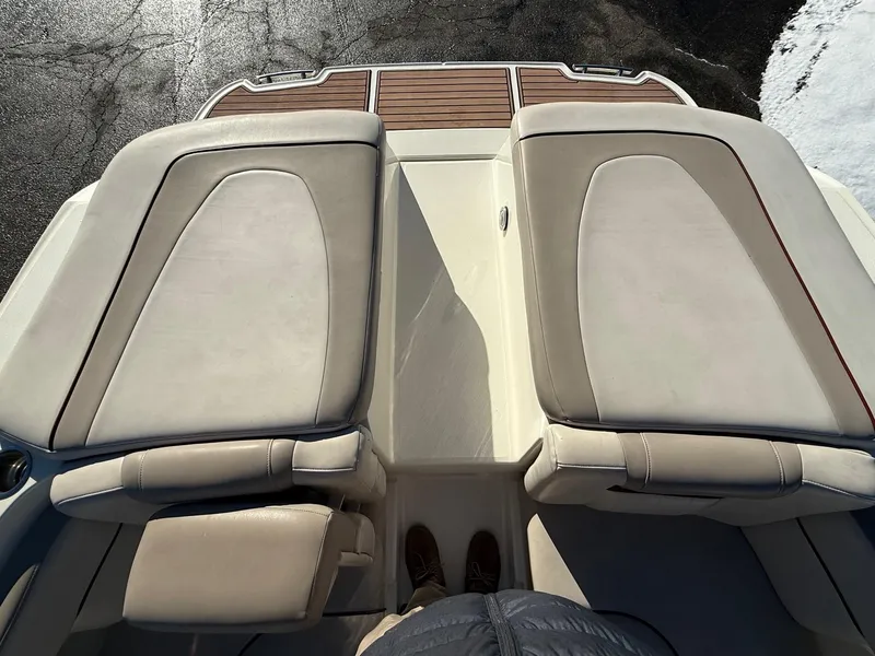 Slide: The Image of 2005 Sea Ray 270 SLX boat with beige seating and wooden deck accents. - 17